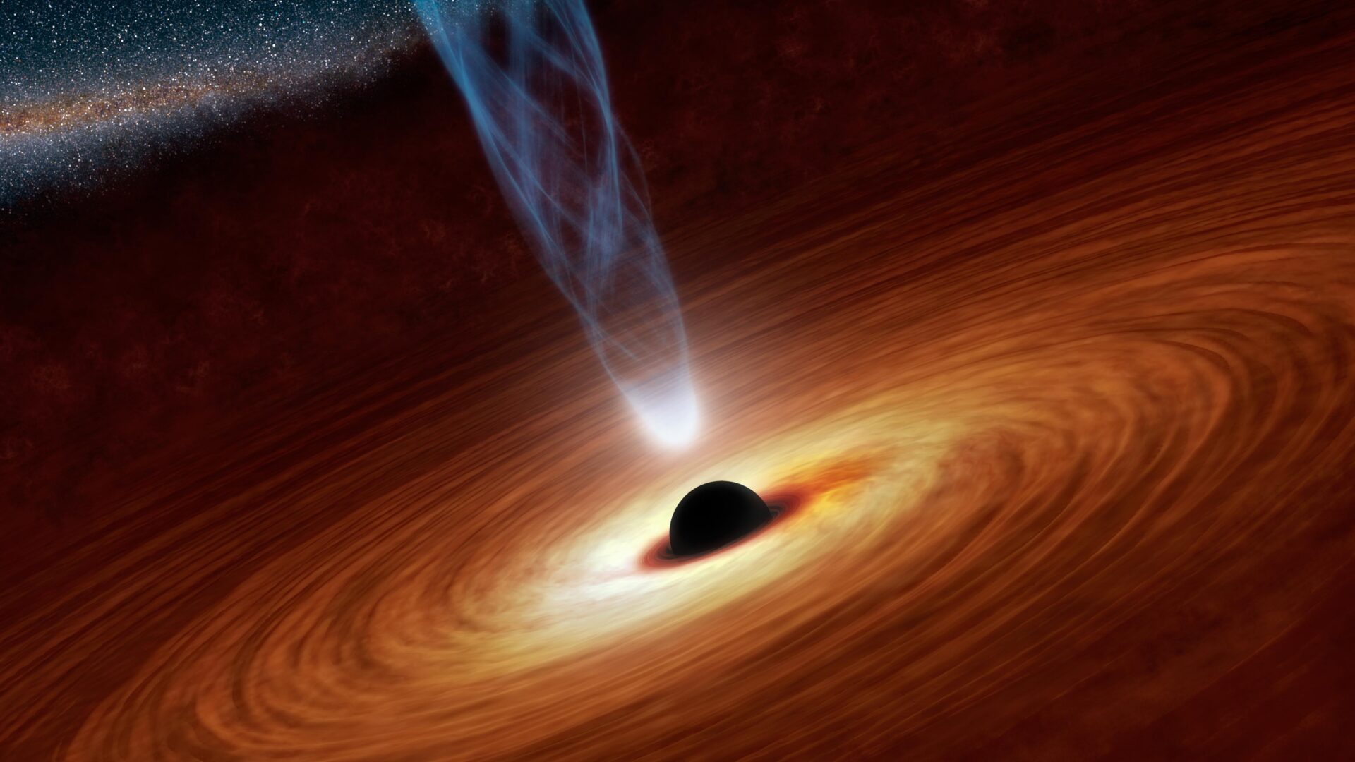 Un buco nero super massiccio, cioè con massa compresa tra centinaia di migliaia e miliardi di volte la massa solare, circondato dal disco di accrescimento, che emette onde elettromagnetiche e getti di plasma Crediti: NASA/JPL-Caltech https://www.jpl.nasa.gov/spaceimages/details.php?id=pia16695