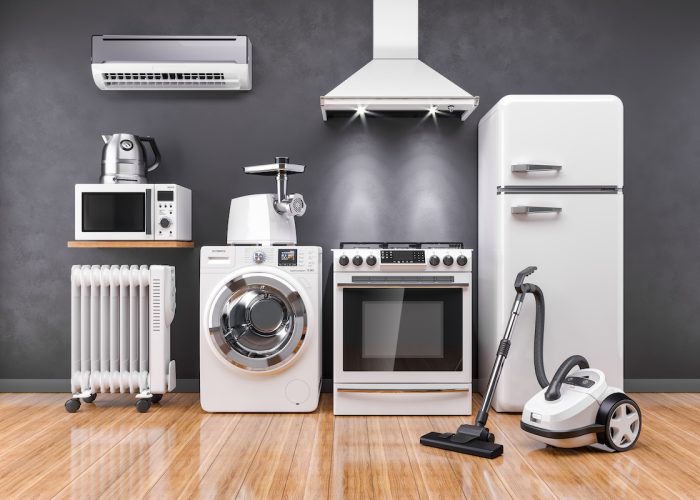 Set of home kitchen appliances in the room on the wall background