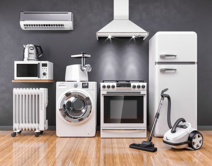Set of home kitchen appliances in the room on the wall background