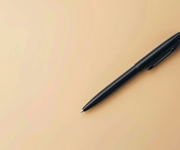 Basic black pen on a neutral background, ideal for personalized branding or text