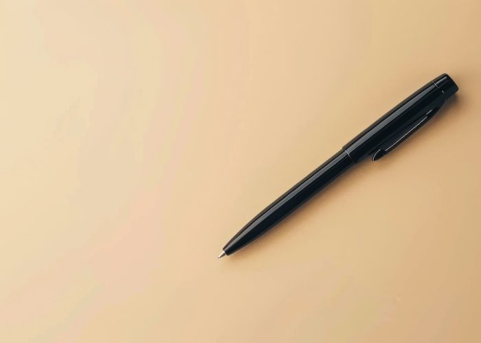 Basic black pen on a neutral background, ideal for personalized branding or text