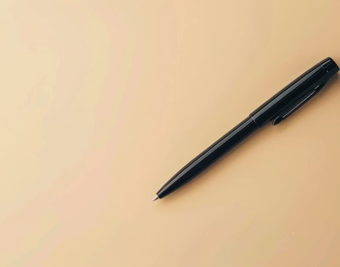 Basic black pen on a neutral background, ideal for personalized branding or text